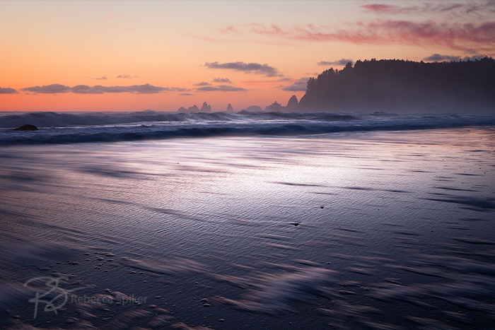 Sunset highlights the texture left behind as waves recede along Rialto Beach in Olympic National Park.